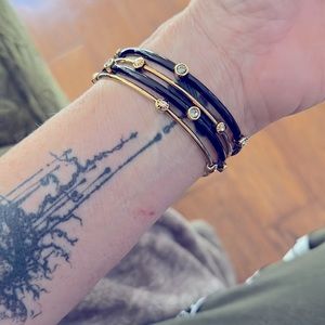 Henri Bendel bangles. Black/gold with gun medal Swarovski crystals